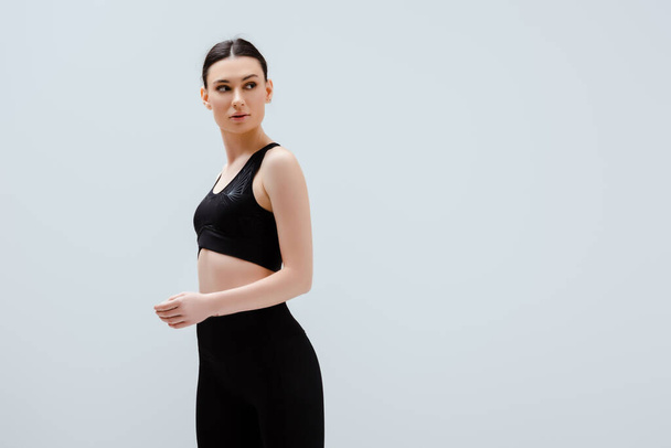 sportive woman in black sportswear isolated on white  - Foto, Bild