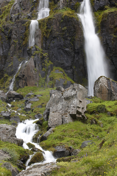 Waterfall and basaltic rocks. Iceland. Seydisfjordur. - Photo, Image