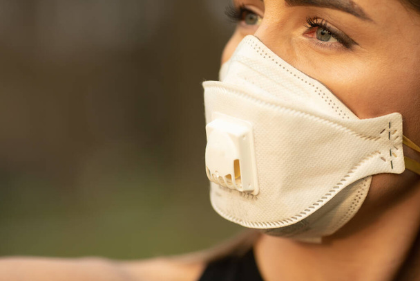 Flu virus protection mask protective against influenza sickness viruses and disease. Sick woman wearing  face mask in public spaces. Healthcare  concept. Corona virus. Covid-19. - 写真・画像