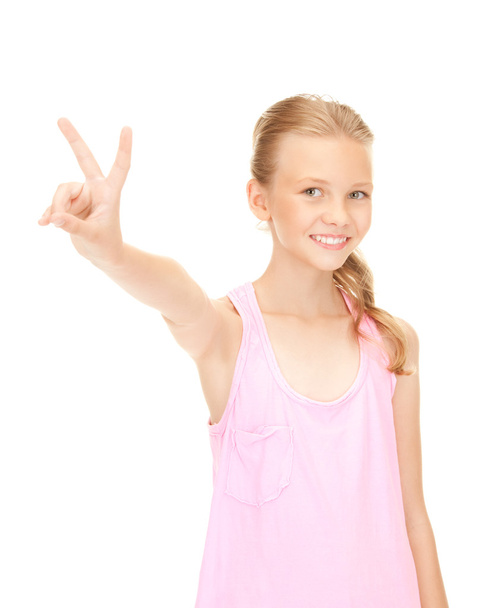 Lovely girl showing victory sign - Фото, зображення