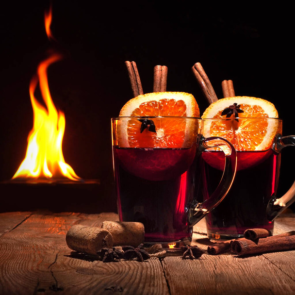 Mulled wine against the fireplace. - Photo, Image