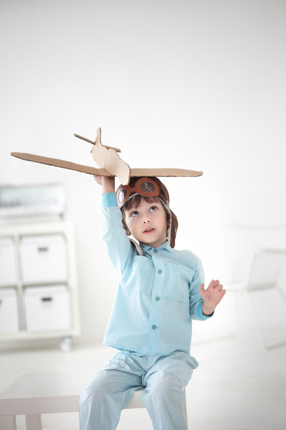 Happy boy play in airplane indoors - Foto, imagen