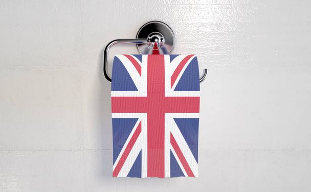 A roll of toilet paper with a print of the british flag hanging on a chrome toilet roll holder - 3D render - Photo, Image