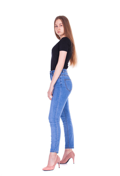 Full body portrait of a young beautiful model in blue jeans, isolated on white background - Φωτογραφία, εικόνα