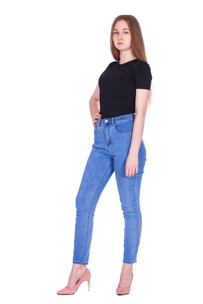 Full body portrait of a young beautiful blonde model in blue jeans, isolated on white background - Foto, immagini