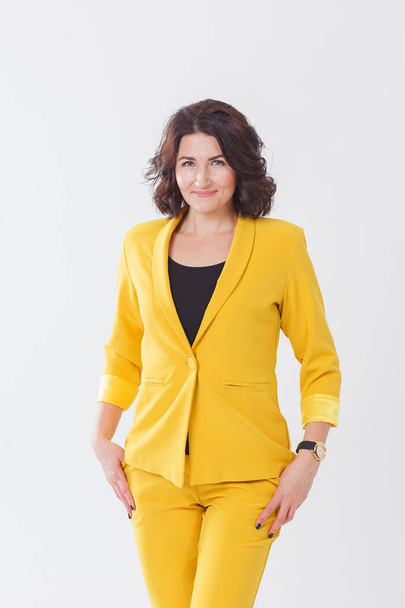 woman in yellow suit alone isolated - Photo, Image