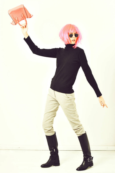 fashionable sexy girl in pink wig posing with fashion bag - Fotoğraf, Görsel