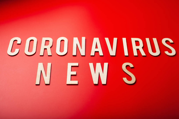 coronavirus news word text wooden letter on red background corona virus covid-19 - Photo, Image