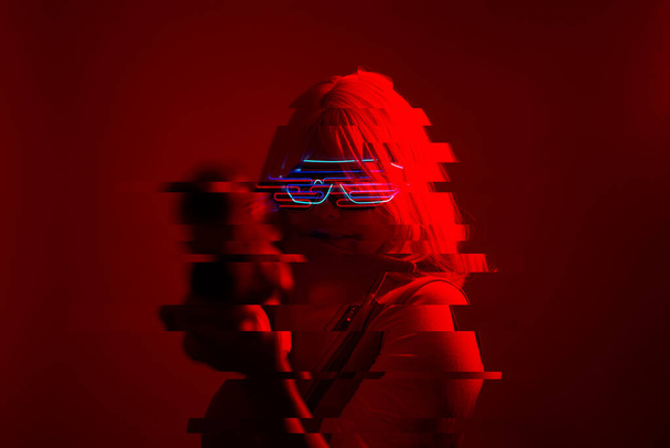 Girl with blaster in the futuristic battle. Concept virtual reality, cyber game. Image with glitch effect. - Foto, immagini