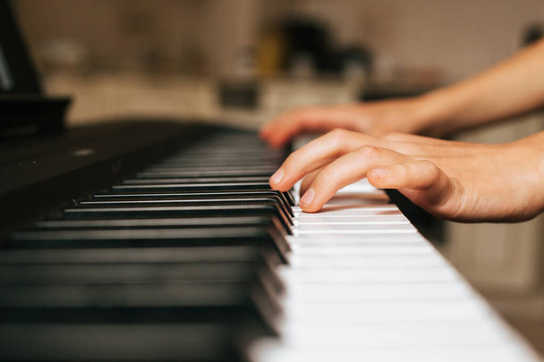 Child hands playing piano - Photo, Image