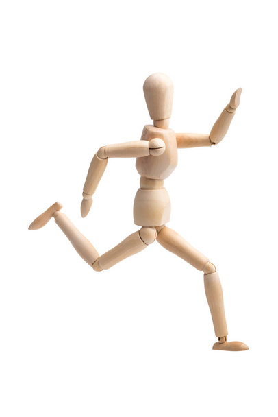 Wooden figure running isolated on white background with clipping paths. - Foto, immagini
