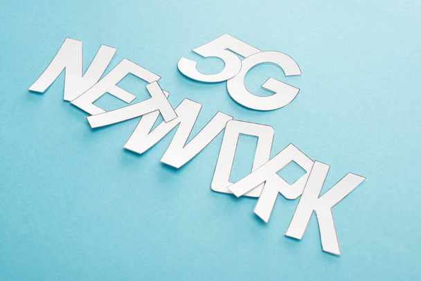 white 5g network lettering on blue background - Photo, Image