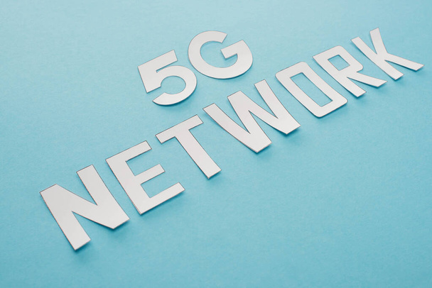 white 5g network lettering on blue background - Photo, Image