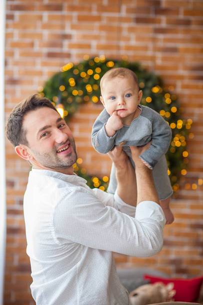 christmas dad and little son smiling - Fotó, kép