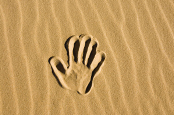Hand print in the sand - Фото, изображение