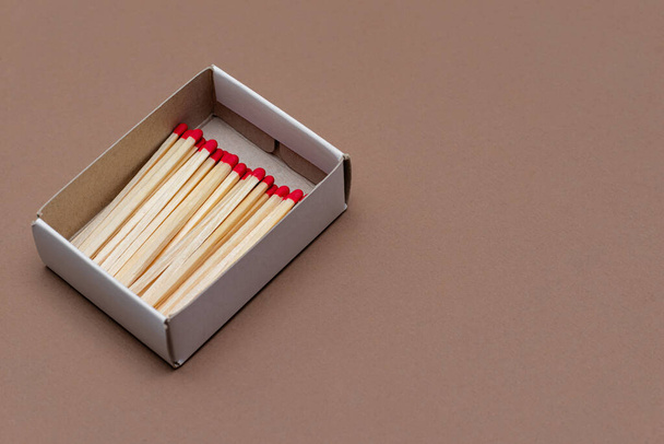 matches in a cardboard box on a craft color background - Photo, Image