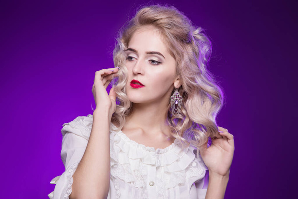 Beautiful, tender, blond woman in a white old blouse. On a purple background. Exquisite girl - Foto, Imagem