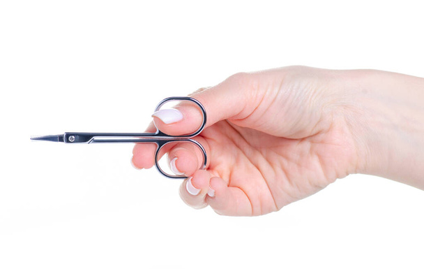 Nail scissors in hand - Foto, afbeelding