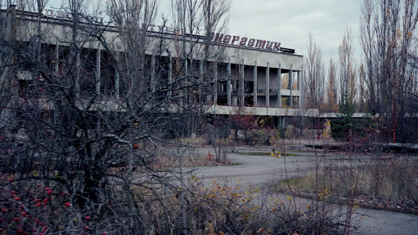 CHERNOBYL, UKRAINE - NOVEMBER 6, 2019: abandoned building with palace of culture and energetic lettering  - Séquence, vidéo