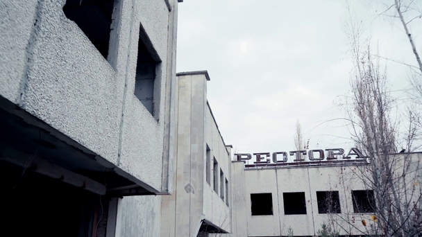 CHERNOBYL, UKRAINE - NOVEMBER 6, 2019: abandoned building with restaurant lettering  - Πλάνα, βίντεο