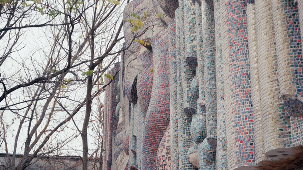 CHERNOBYL, UKRAINE - NOVEMBER 6, 2019: abandoned building with mosaic facing near trees - Кадры, видео
