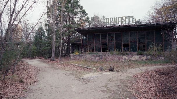 CHERNOBYL, UKRAINE - NOVEMBER 6, 2019: abandoned building with Pripyat lettering  - Кадри, відео