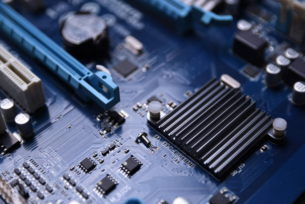 Computer motherboard and electronical components cpu gpu memory and different sockets for a video card close up - 写真・画像