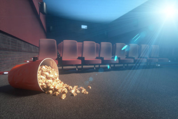 Koronavirüs salgını sırasında terk edilmiş bir sinemada patlamış mısır kovası. - Fotoğraf, Görsel