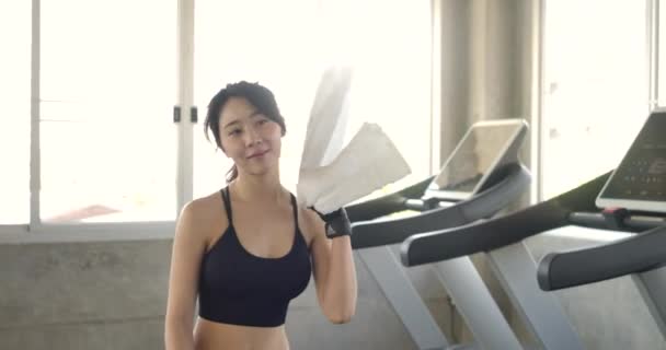 Follow-up Shot of Athletic Beautiful Asian Woman Entering Gym in Slow Motion. She's Confident and Pulls Her Ponytail. - Záběry, video