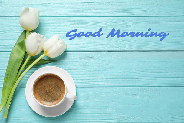White tulips and coffee on light blue wooden table, flat lay with space for text. Good morning - Photo, Image