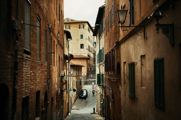 Street view with old buildings in Siena, Italy. - Photo, Image