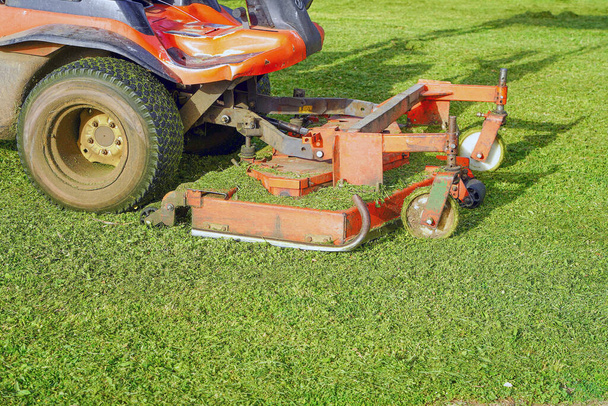 Lawn Care. Riding Mower. Grass. Machine mower on a background of green lawn. - Photo, Image