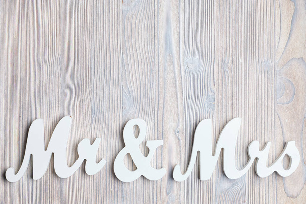 White letters mr and vhk on a wooden background. Top view. Copy space. Close up. - Photo, Image