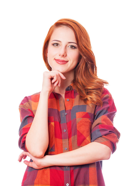 Redhead girl in shirt on white background isolated. - Foto, afbeelding
