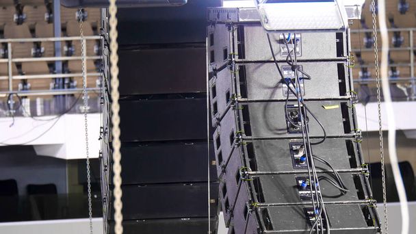 Installation of professional audio equipment. Stock footage. Powerful curved sound speakers for better sound at concerts or competitions - Photo, Image