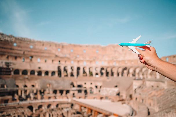 Small airplane model background Coliseum, Rome, Italy - Photo, Image
