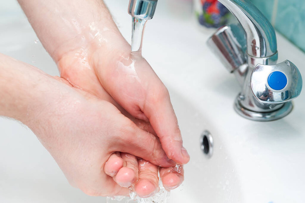 Man washing hands with a soap to prevent any disease or coronavirus. - Valokuva, kuva