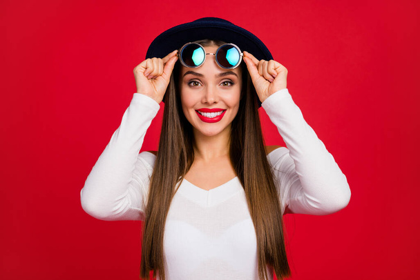 Portrait of cheerful pretty chic fascinating girl touch eyewear eyeglasses enjoy fall rest relax weekend wear good loom outfit isolated over bright shine color background - Foto, Imagen
