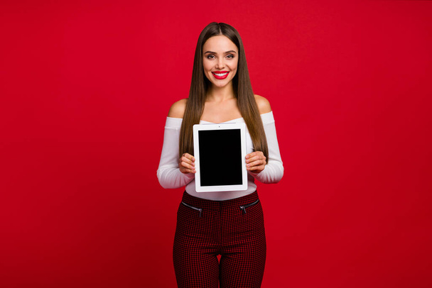 Portrait of attractive lovely dreamy girl promoter hold tablet display modern technology ads promo wear good look trousers - Foto, Imagem