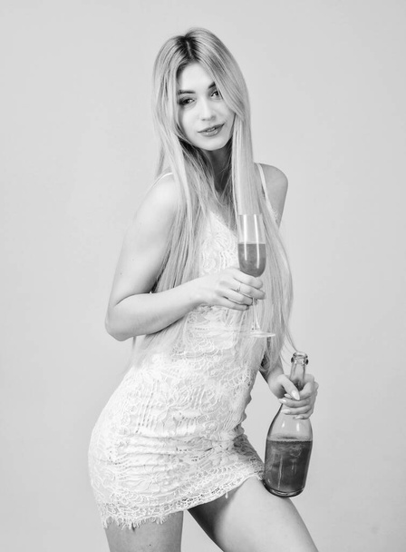 Woman white dress bottle glass alcohol drink. Hen party concept. Luxury champagne. Pretty blonde celebrate birthday party. Sweet liquor. Glamorous party. Girl drinking pearl glitter champagne - Fotoğraf, Görsel