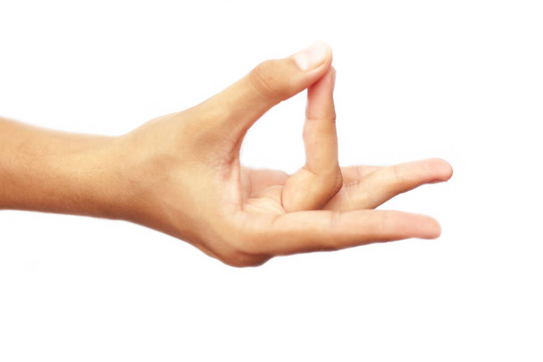 Human hand doing Akash Yoga Mudra isolated on a white-colored seamless background. Shot of single-hand demonstrating Akash Mudra. - Foto, immagini