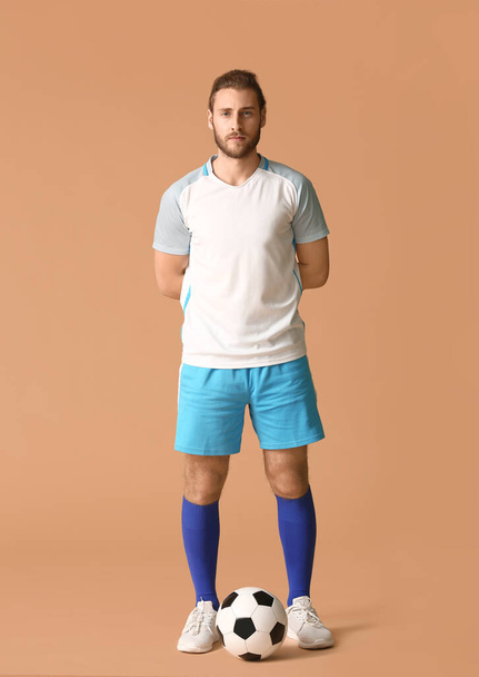 Male football player on color background - Valokuva, kuva