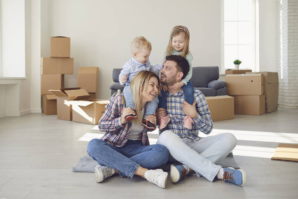 Happy family smiling at a new house moving. - Photo, Image
