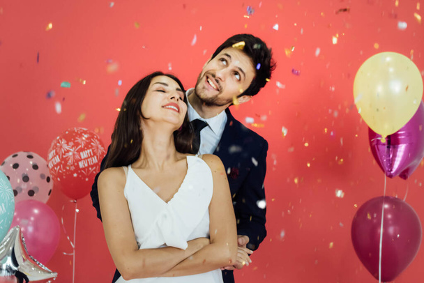 Young couple celebrating new year together. - 写真・画像
