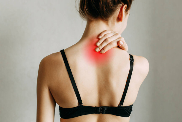 Neck and back injuries, and fatigue at work. The zone of injury, the image on a blank background. A spasm in the girl's neck. - Φωτογραφία, εικόνα