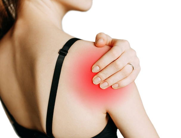 Shoulder and joint injuries, and fatigue at work. The zone of injury, the image on a blank background. A spasm on the girl's shoulder.  - Photo, image