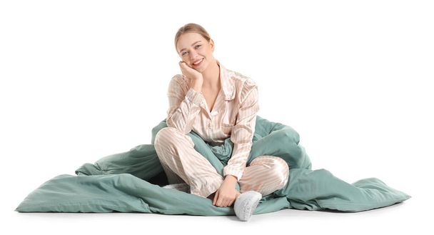 Young woman with blanket on white background - Photo, Image