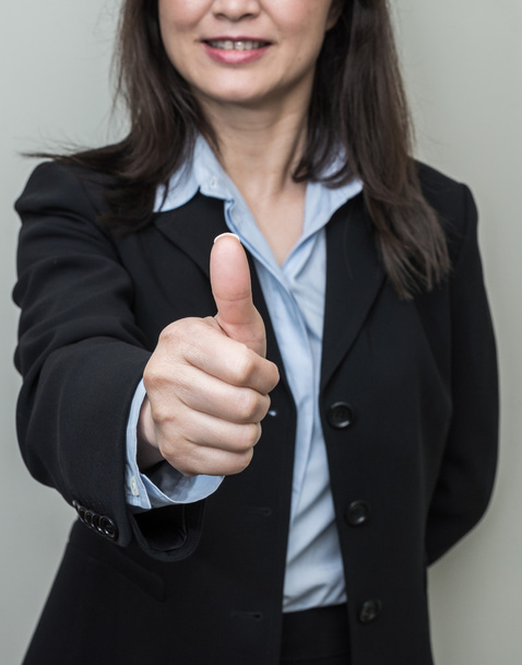 Woman giving thumbs up - Photo, Image