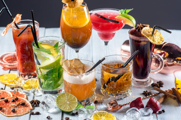 A set of different colored cocktails at the bar - Fotó, kép