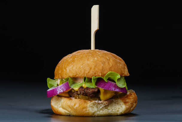 Burger on black background closeup - Photo, Image